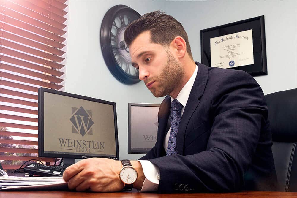 personal injury protection lawyer in Florida reviewing an injury claim