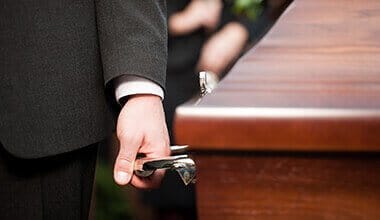 pallbearers at a funeral for a wrongful death