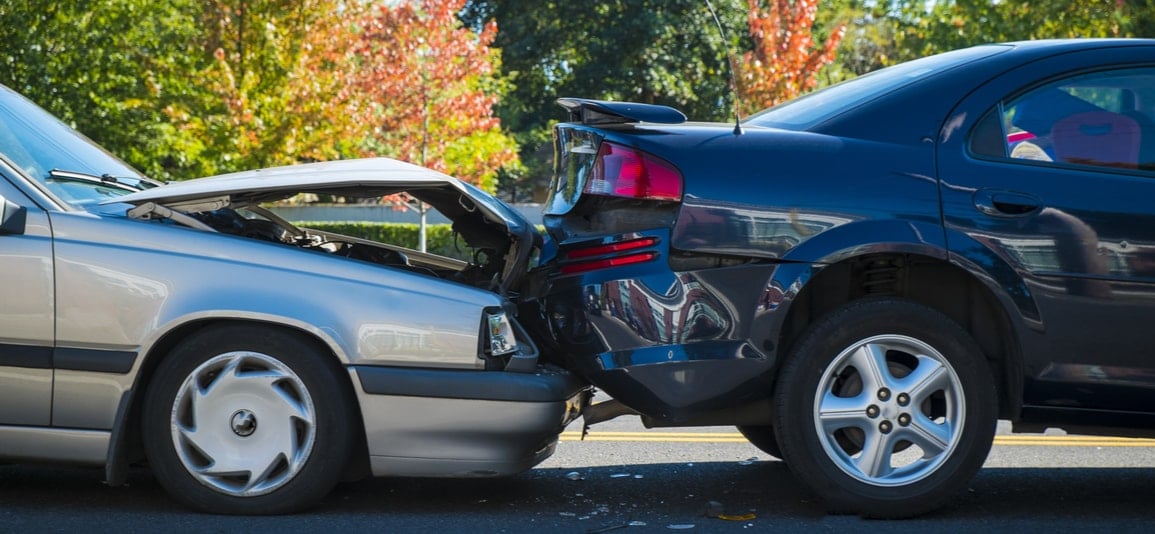 a rear end crash between a volvo and a sedan