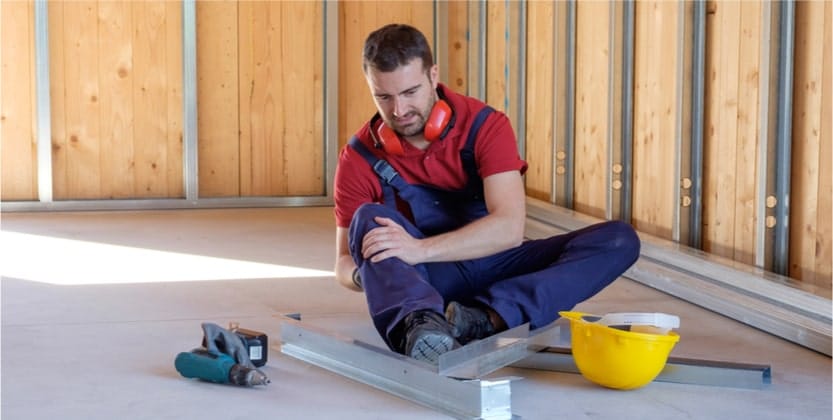 A man experiencing a workplace injury in South FL