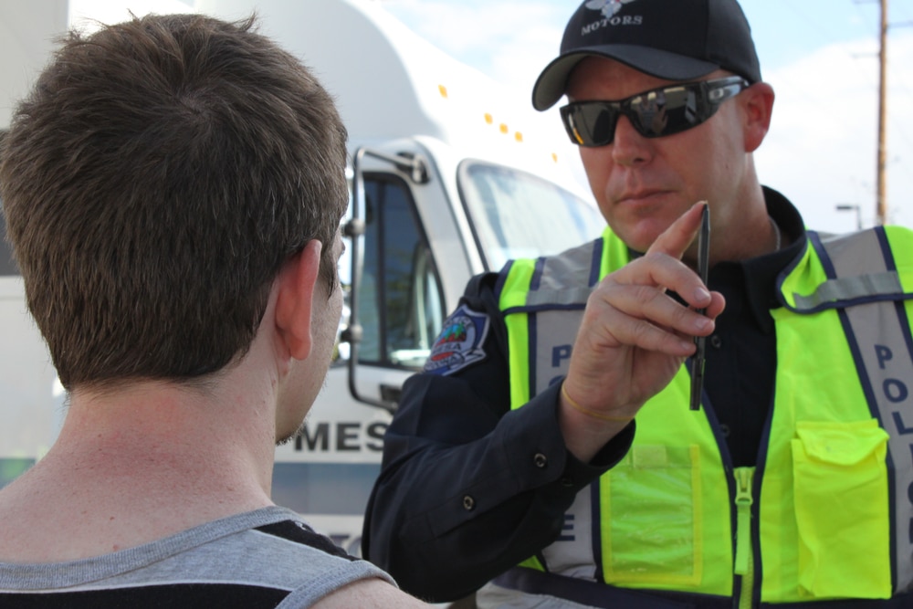 Officer arresting a man for DUI in Floria