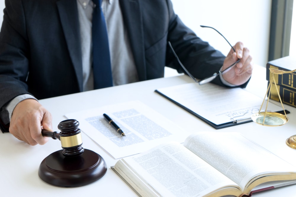 Man seeking legal advice for defense against domestic violence by strangulation charge